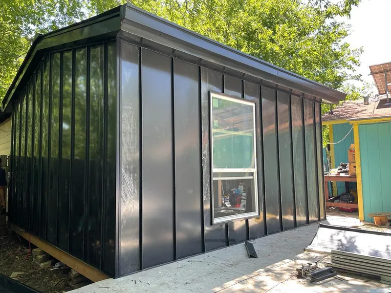 Black standing seam metal wall panels for Roof Inspection in Woodbridge